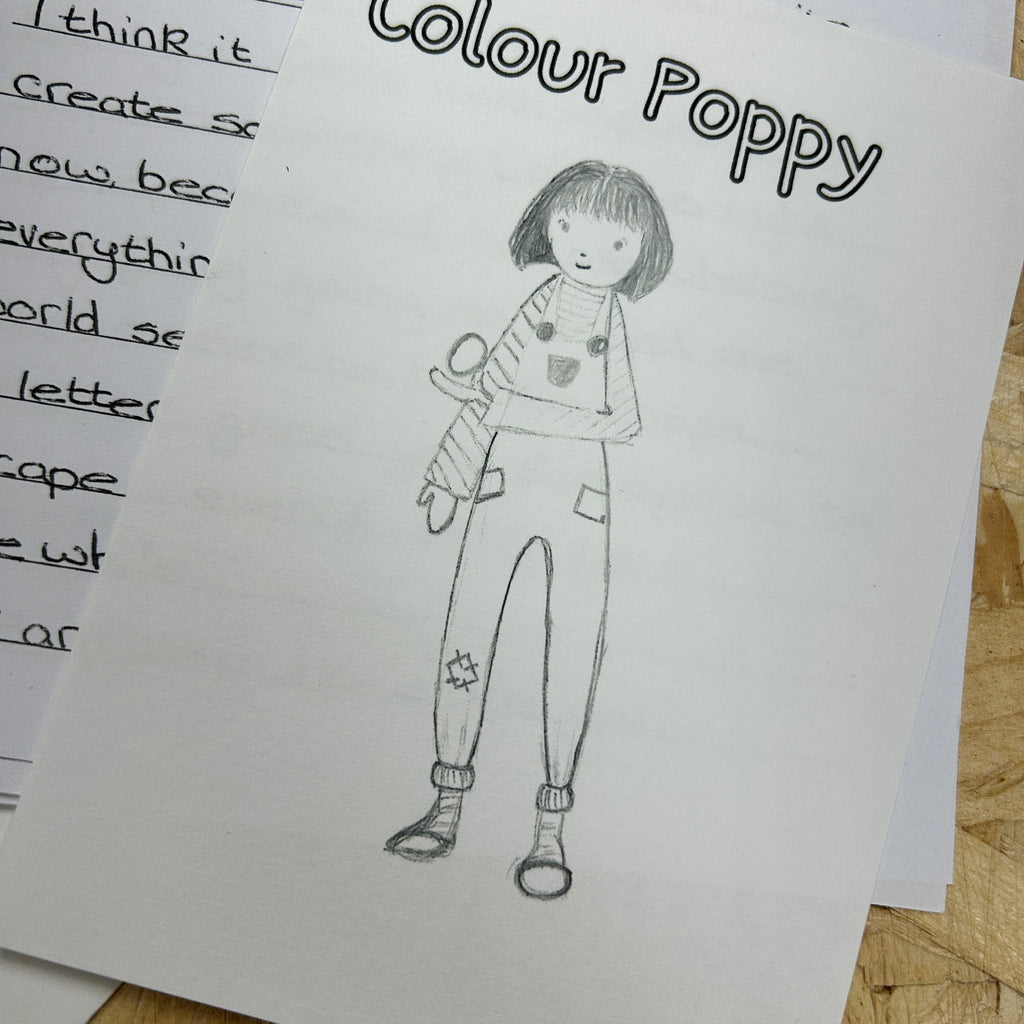Black and white drawing of a person labeled 'Colour Poppy' on a piece of paper.
