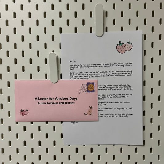 Pink Envelope in front of a Letter for Anxious Days