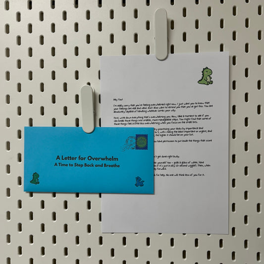 Letter for Overwhelm and blue envelope on a pegboard
